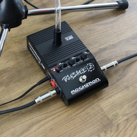 Banshee 2 Talk Box Guitar Effects Pedal with built-in amplifier and tube mouthpiece for electric guitar setup on floor.