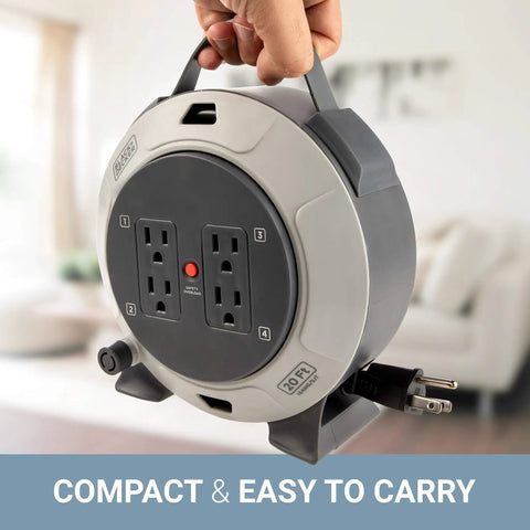 Person holding Retractable 20 Foot Extension Cord Reel With Four Outlets Heavy Duty 16 AWG SJT Cable Thermal Breaker Reset Button