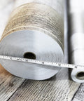 Close-up of Wood Grain Peel And Stick Contact Paper 17.3 Inch By 1200 Inch, showing roll texture and size measurement