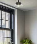 Summit 12 Inch Modern Industrial Farmhouse Semi Flush Mount Ceiling Light with Schoolhouse Glass Shade in Matte Black Finish in kitchen