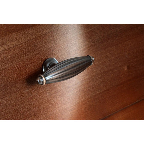 Expression Cabinet Knob Set 65mm Brushed Oil Rubbed Bronze 10 Pack on wooden drawer, traditional hardware style