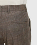 Back view of brown plaid trousers with a welt pocket