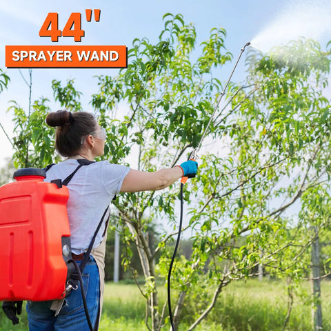 Person using All Metal 44 Inch Replacement Sprayer Wand For Garden Hose With Brass Connector in garden.