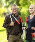 Two gardeners holding F25057 Swiss Made Hedge Shears For Gardening 22 Inch Lightweight Precision Clippers in garden.