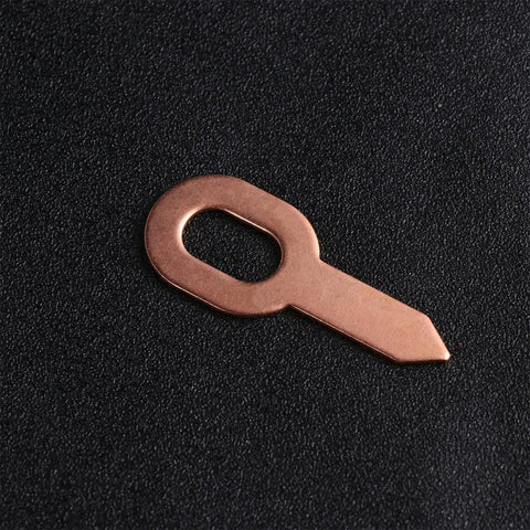 Close-up of a copper repair tool from the Awesome 50 Pcs Aluminum Sheet Metal Repair Kit for precise adjustments.