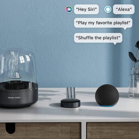 AirPlay 2 Wireless Audio Streamer for Multiroom Stereo and TV Audio Preamplifier on a table with smart speakers and glass cover