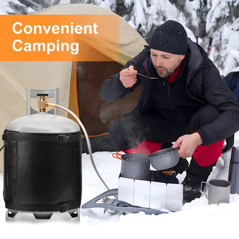 Camper using a Gas Cylinder Heater Wrap With Thermostatic Control for 20-40 lb LP Tanks in a snowy outdoor campsite.