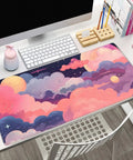Cute Desk Pad With Kawaii Clouds In Pink And Purple XXL Full Desk Mat For Gaming And Work displayed on an office desk.