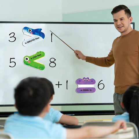 Teacher using Magnetic Greater Than Less Than Equal Signs Math Set for classroom demonstrations on whiteboard.