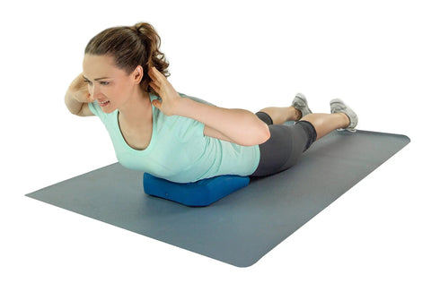 Teeter Core Restore Inflatable Lumbar Support Cushion For Back Pain Relief And Posture Correction used by a woman during core exercises.