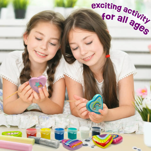 Two girls painting heart rocks with the Glow In The Dark Heart Rock Painting Kit For Kids Ages 4 To 12, STEM Craft Set With Puffy Paint