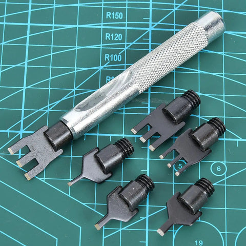 Flat Prong Leather Chisel Set with six interchangeable heads on a grid mat for DIY leather craft high hardness durable leatherworking kit.