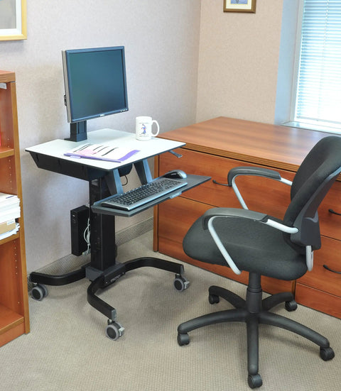 Smooth Roll Single Monitor Sit Stand Desk With Zero Effort Height Lift And Heavy Duty Caster Wheels For Vesa Monitors Up To Twenty Four Inches in an office setup.