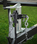 Heavy Duty Trailer Towing Organizer With Aluminum Chain Holder And 7 Way Plug Cover, attached to trailer jack on grass surface