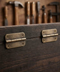 Antique Iron 12 Pack Old School Cabinet Hinges With Four Hole Mounting And Rounded Corners on wooden surface