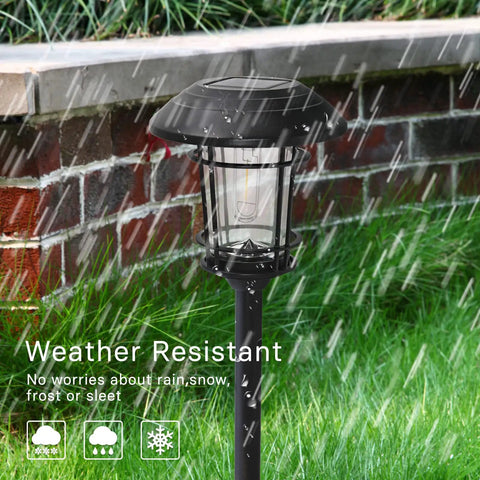 5 Pack Solar Outdoor Pathway Lights With Glass Lantern-Style Heads in rain, brick background, durable weatherproof design