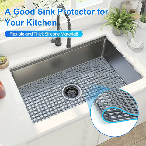 Silicone Sink Mat 24.6 By 13 Inches No Slip Heat Resistant Kitchen Sink Protector For Stainless Steel Sinks Center Drain Grey 1 Pack Flexible Durable Easy To Clean in use in a stainless steel sink.