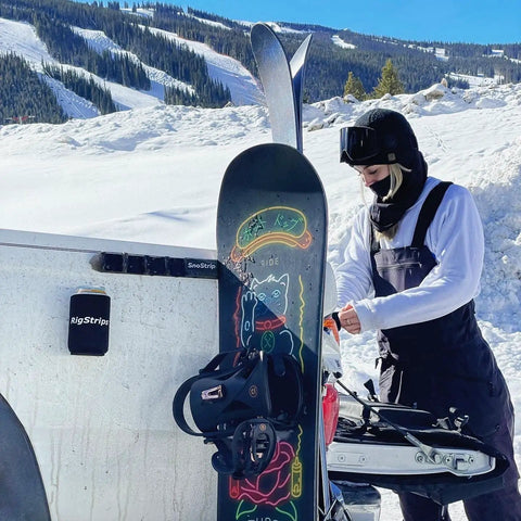 Badass Magnetic Ski And Snowboard Vehicle Rack Keeping Your Ride Spotless With Soft Waterproof Padding For Reliable All Season Winter Storage And Trail Ready Adventures in use with snowboard.