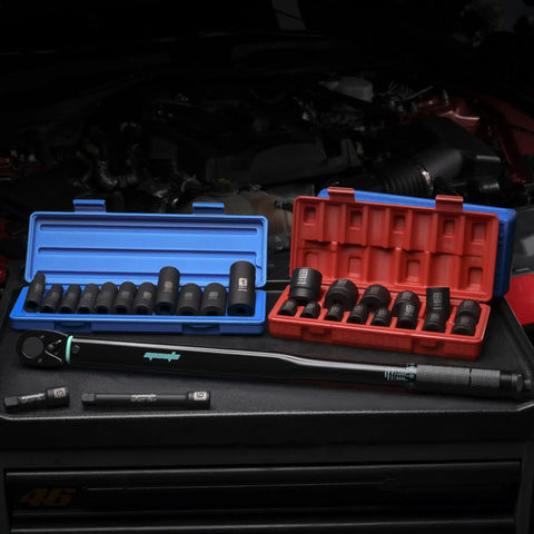 Beefy 1/2-Inch Drive Click Torque Wrench With 25-250 Ft-Lb Range shown with sockets and case in a garage setting