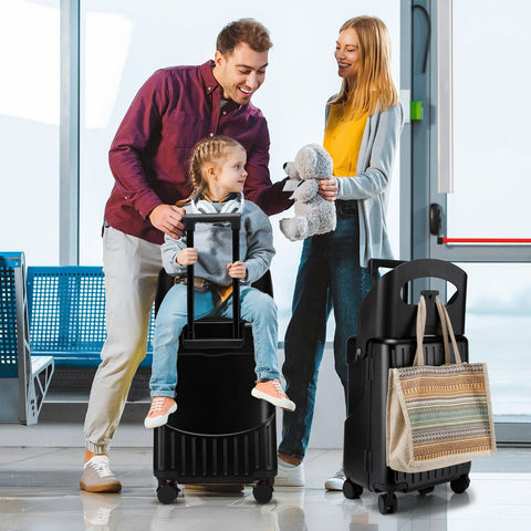 Front view of black 20-inch ride-on kids' luggage with built-in seat and spinner wheels.