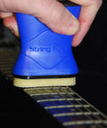 String Fuel Guitar String Cleaner And Lubricant With Microfiber Cloth For Electric, Acoustic, Bass And Banjo Use, Premium Oil Blend Keeps Strings Clean, Slick, And Long Lasting Tone For Everyday Playability. blue string cleaner in hand on guitar neck