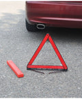 Reflective triangle from Beefed Up Roadside Emergency Car Kit With Jump Cables And Tow Strap Premium Auto Safety Gear on asphalt