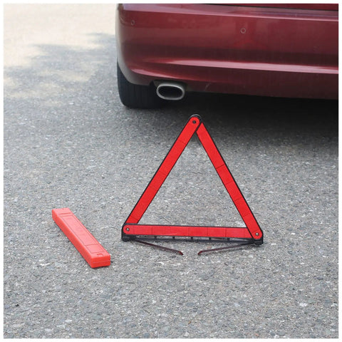 Reflective triangle from Beefed Up Roadside Emergency Car Kit With Jump Cables And Tow Strap Premium Auto Safety Gear on asphalt