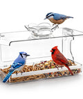 Crystal Clear Window Bird Feeder With Non Marking Self Adhesive Hooks For Easy Setup Super Clear View For Close Bird Watching Outdoor Garden Decor And Awesome Gift For Nature Lovers displaying two bird feeding trays with assorted seeds and birds.