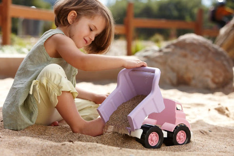 Child playing with Pink Dump Truck Toy For Toddlers, BPA Free And Phthalates Free Eco Friendly Plastic Play Vehicle in sandbox