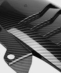 Close-up of Top Shelf Carbon Fiber Rear Fender Blocks with detailed texture, designed for heavy-duty splash protection.