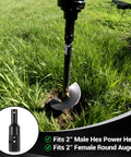 Heavy Duty 2 Inch Hex Female To 2 Inch Round Male Auger Adapter in use with 2 Inch Round Auger in grassy field