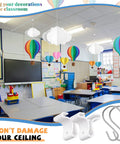 Drop Ceiling Hooks 35 Pack With S Clips For Hanging Ornaments Christmas Classroom Office Decor White Metal Hangers For 1 Inch Bar Rails Great For Classrooms Offices And Holiday Displays, shown in a colorful classroom setting.