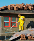 Worker in yellow suit using Eight Piece One Quarter Inch NPT Quick Connect Air Hose Fittings Kit for cleaning roof tiles