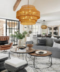 Epic Large Gold Boho Rattan Chandelier With 8 Lights, handwoven light fixture hanging in stylish living room with modern decor.
