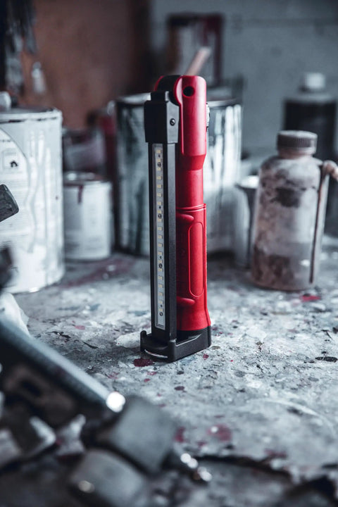 Red Stinger Switchblade 800 Lumen Rechargeable Multi Function LED Work Light on a workshop table