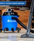 Beast 12 Gallon Wet Dry Vacuum with Detachable Blower in workshop, 5 Peak HP, 106 CFM, showing wide stance and hose setup