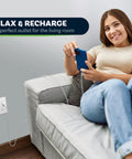 Woman relaxing on sofa using USB Outlet With Type A And Type C USB Ports, 5.8A Total Output, 15 Amp Tamper-Resistant Receptacle