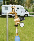 Front view of brass lead-free RV water pressure regulator valve with gauge and inlet filter.