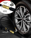 JACO 12-piece 1/4-inch NPT air hose quick-connect fittings kit with brass couplers and steel plugs, attached to an air hose near a car wheel