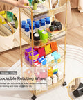 Sleek Clear Acrylic 2 Tier Rolling Utility Cart With Sturdy Handle And Smooth Lockable Wheels Compact Storage Trolley For Kitchen Bathroom Tight Spaces Easy Clutter Control Game Changer with colorful items on shelves.