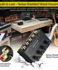 4 Channel Stereo Audio Mixer With RCA Inputs And Independent Volume Controls For TV PC DJ Home Studio Setup No Power Required Plug And Play Metal Housing Ultra Low Noise shown on desk