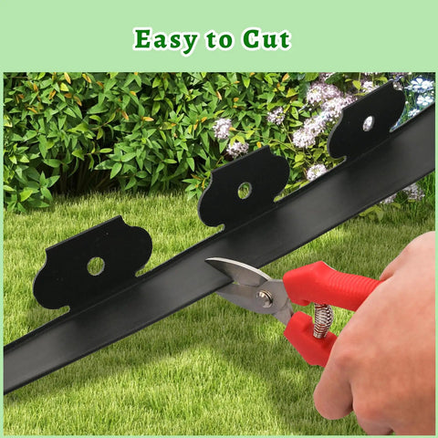 Pruning scissors cutting 40 Ft Black Garden Edging Kit With 2 Inch Tall Border, 8 Inch Spiral Anchoring Spikes, And Garden Pruning Scissors For Lawn Edging, Landscaping And Garden Borders For Diy Friendly Lawn Border Setup on grass