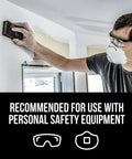 Man using Dual Grit Drywall Sanding Sponge For Medium Remove And Fine Smooth Flexible Foam Block wearing safety gear