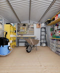 Interior of Outdoor Metal Storage Shed Black 10x12 Ft with tools and equipment, showcasing spacious organization potential.