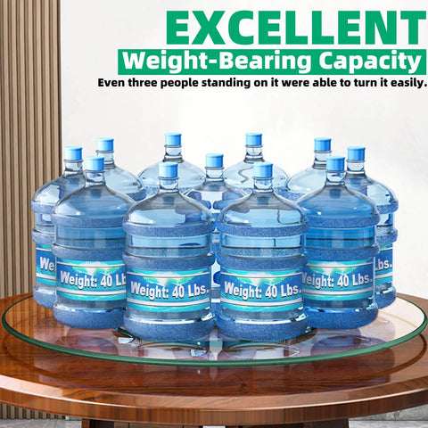 Glass Lazy Susan holding nine 40 lbs water jugs, showcasing weight capacity, demonstrating 26.7 Inch Tempered Glass Lazy Susan For Tabletop Heavy Duty Rotating Serving Tray Spinning Food Server For Dining Table Kitchen Organizer Party Ready Centerpiece 68 Cm Diameter.