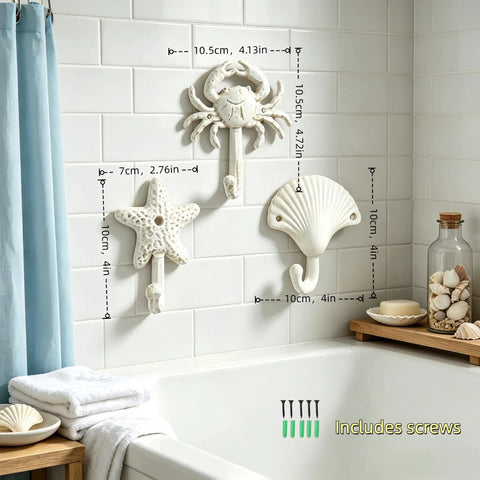 Heavy Duty Cast Iron Coastal Wall Hooks Set of 3 Legit Retro Charm with crab, starfish, and seashell in bathroom setting.