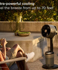 FlexBreeze Pro Mist Fan Indoor Outdoor Chill Machine in charcoal grey on patio, oscillating for 70 ft cooling reach