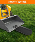 Clamp On Quick Spade Attachment for Skid Steer Buckets and Pallet Forks 46 Inch By 19 Inch Heavy Duty Built Tough Shovel with Integrated Chain Hook attached to skid steer bucket on grass.