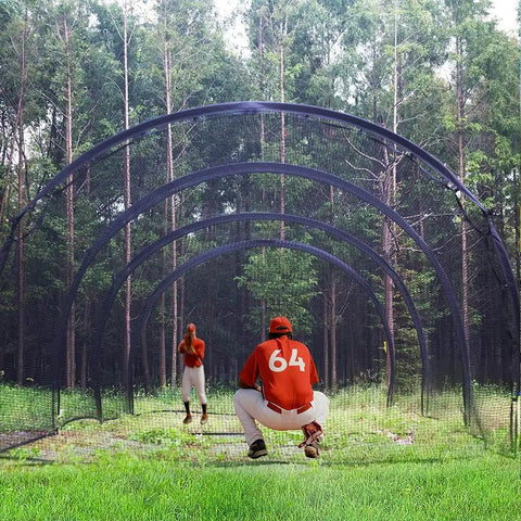 22 Ft Baseball and Softball Batting Cage With Pitching Backstop setup in a backyard with players practicing, enclosed netting visible