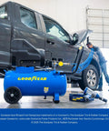 Kickass Oil Free Portable Air Compressor 8 Gallon Horizontal Tank 150 PSI Max Pressure in garage with dark gray truck.